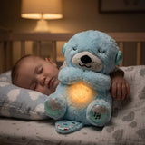 Bebe durmiendo abrazado a la Nutria Peluche