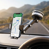 Soporte instalado en el parabrisas de un auto real, con celular mostrando navegación GPS
